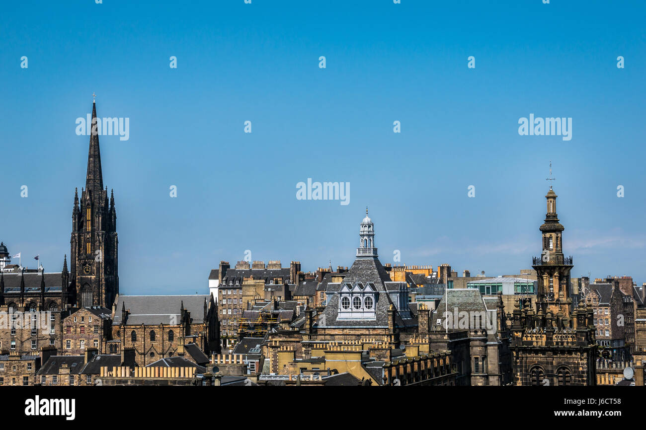 Edinburgh Old Town rooftop skyline, with EIF headquarters The Hub spire, Royal Mile, Scotland, UK against blue sky Stock Photo