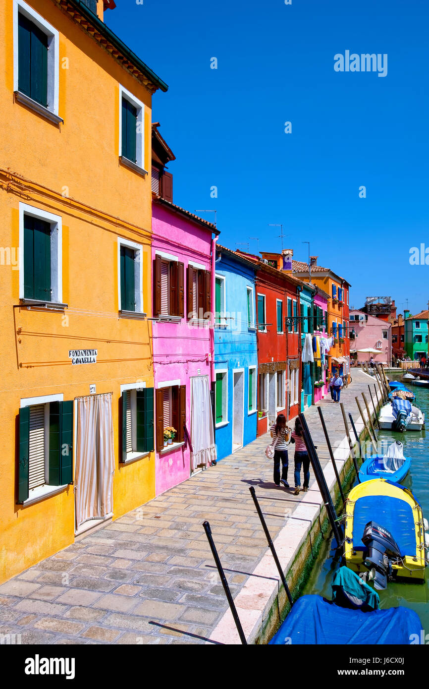 Colorful houses alongside canal in Burano island Stock Photo - Alamy