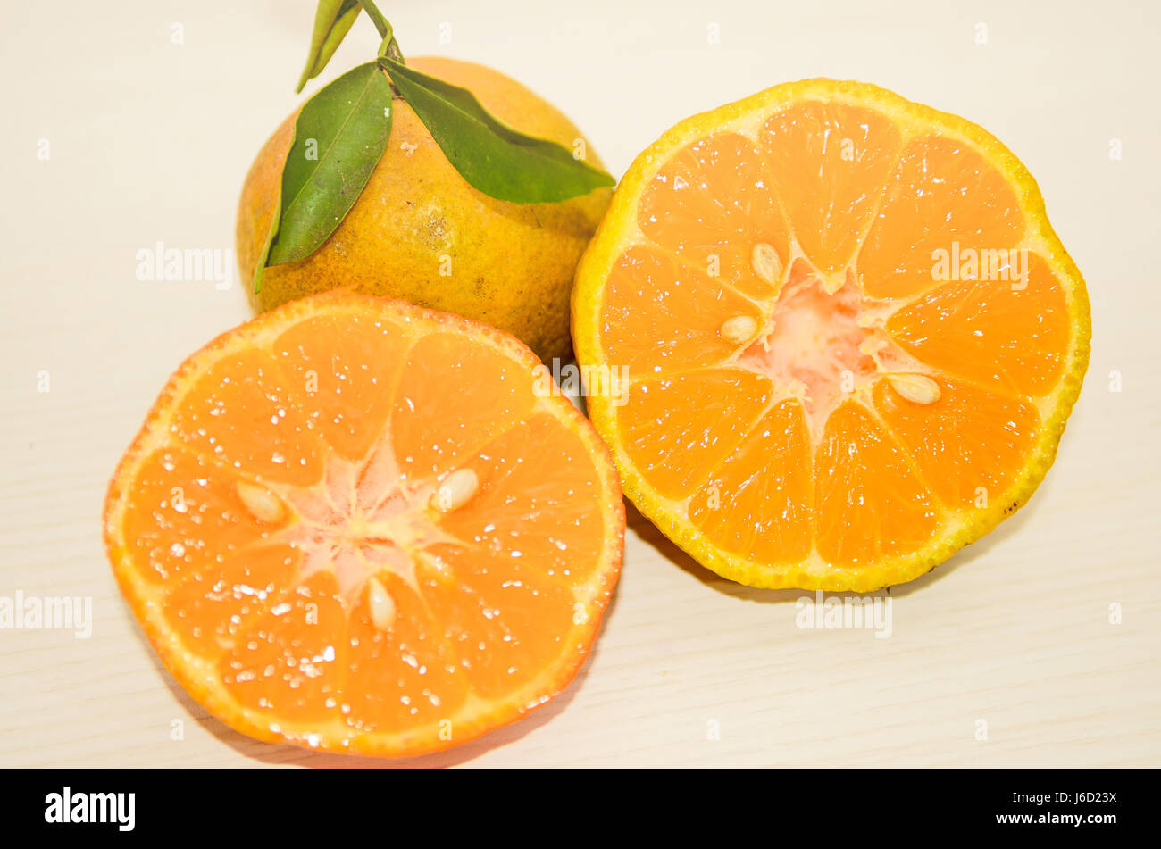 Lemon: Rangpur lime sliced on half with some apparent seeds Stock Photo