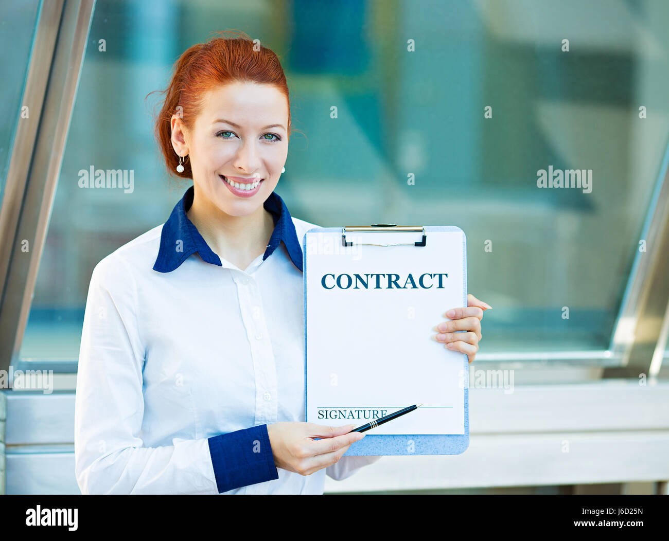 Closeup portrait smiling young business woman, company employee holding