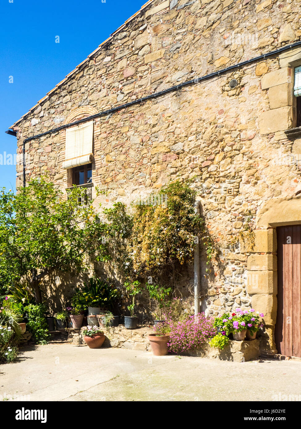 A rustic stone walled house Stock Photo - Alamy