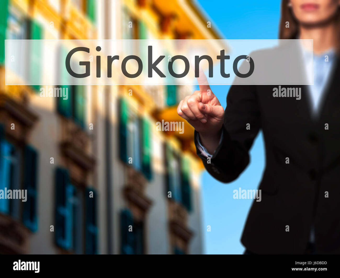 Girokonto (Checking Account) - Businesswoman hand pressing button on touch screen interface. Business, technology, internet concept. Stock Photo Stock Photo