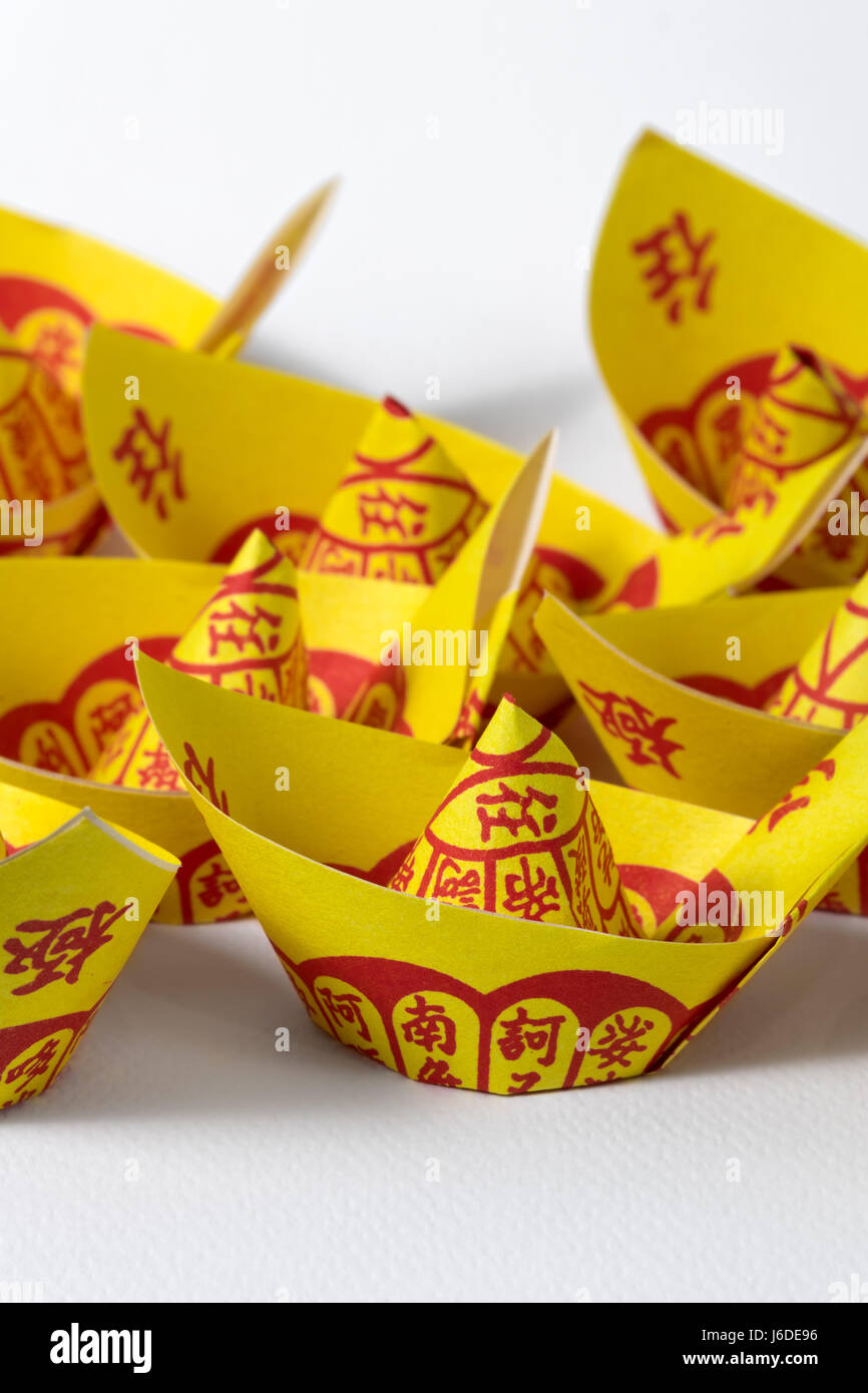 Silver paper, gold paper, joss paper for Chinese celebration isolated on  white background Stock Photo - Alamy