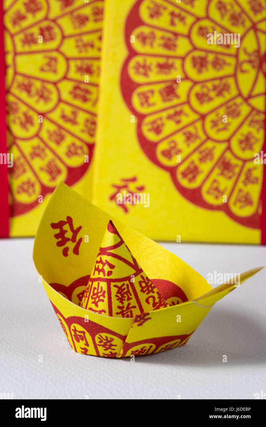 Chinese Joss Paper, Tradition for passed away ancestor's spirits Stock Photo Alamy