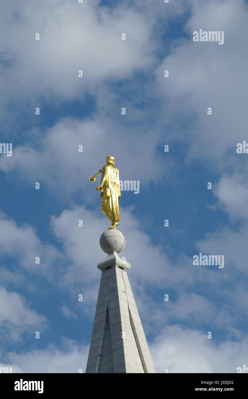 Blue sky white clouds portrait back golden Angel Moroni Statue, Salt