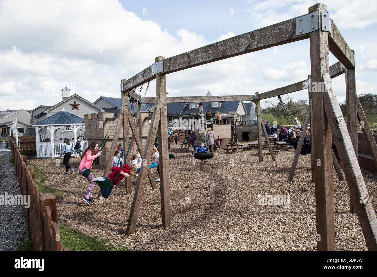 Children playing on the wooden attractions at Billy Bob's Ice Cream