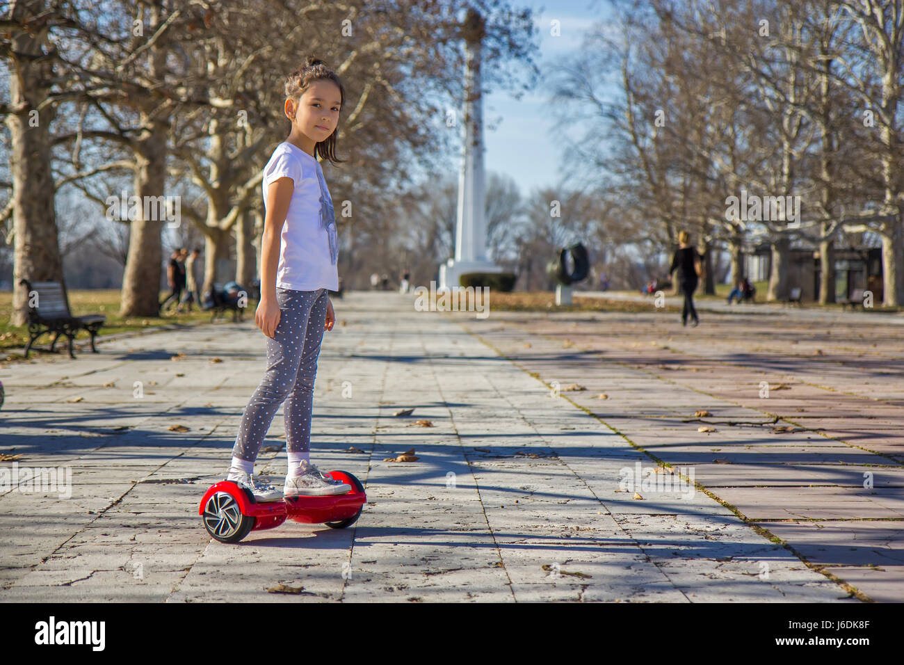 Girl on the hoverboard Stock Photo - Alamy