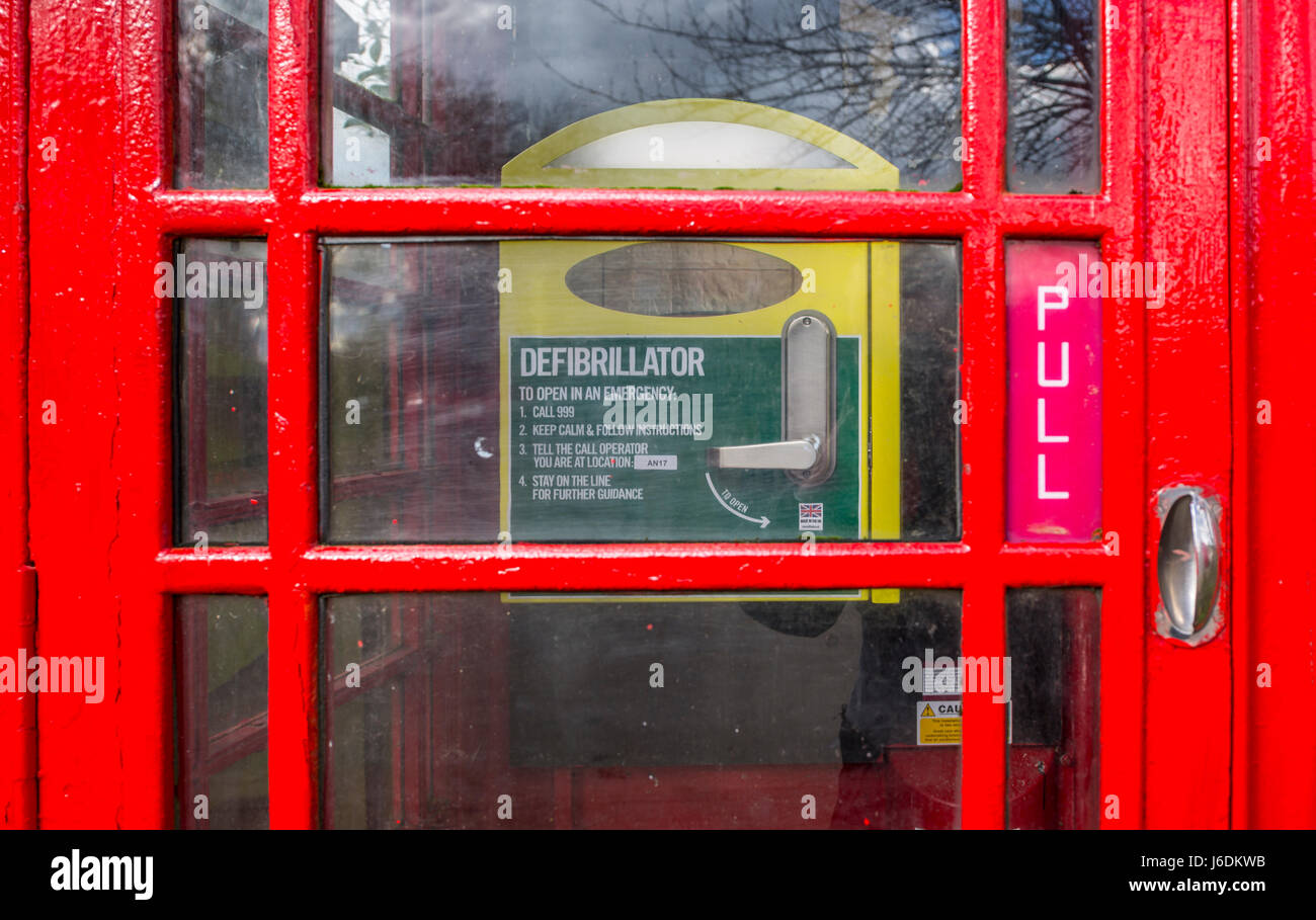 A defibrillator in an old telephone box. Mendham, Suffolk. Stock Photo