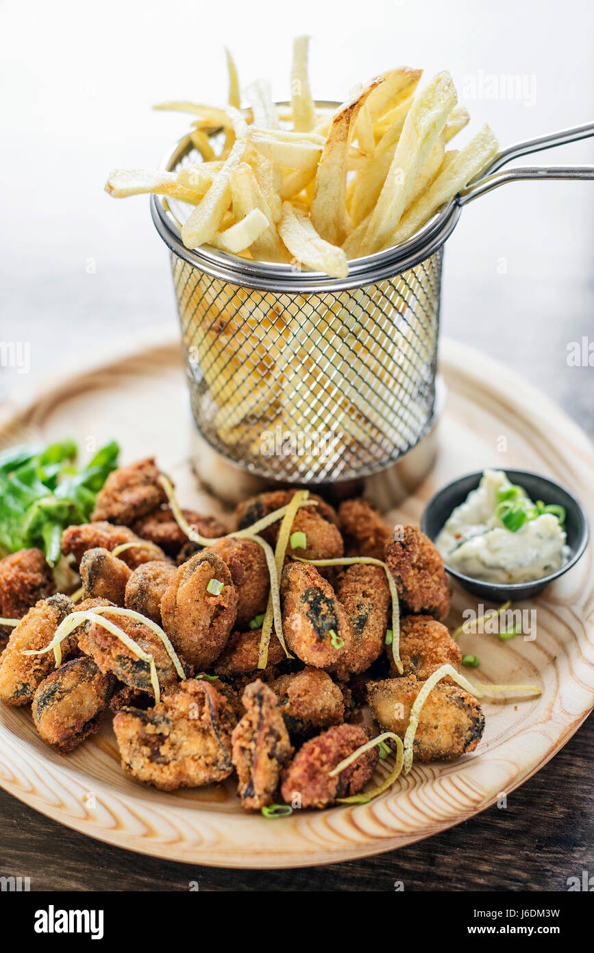gourmet portuguese fried octopus calamari style seafood set meal with fries Stock Photo
