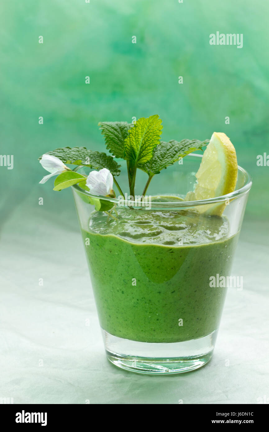 healthy living with green wild herbs smoothie Stock Photo