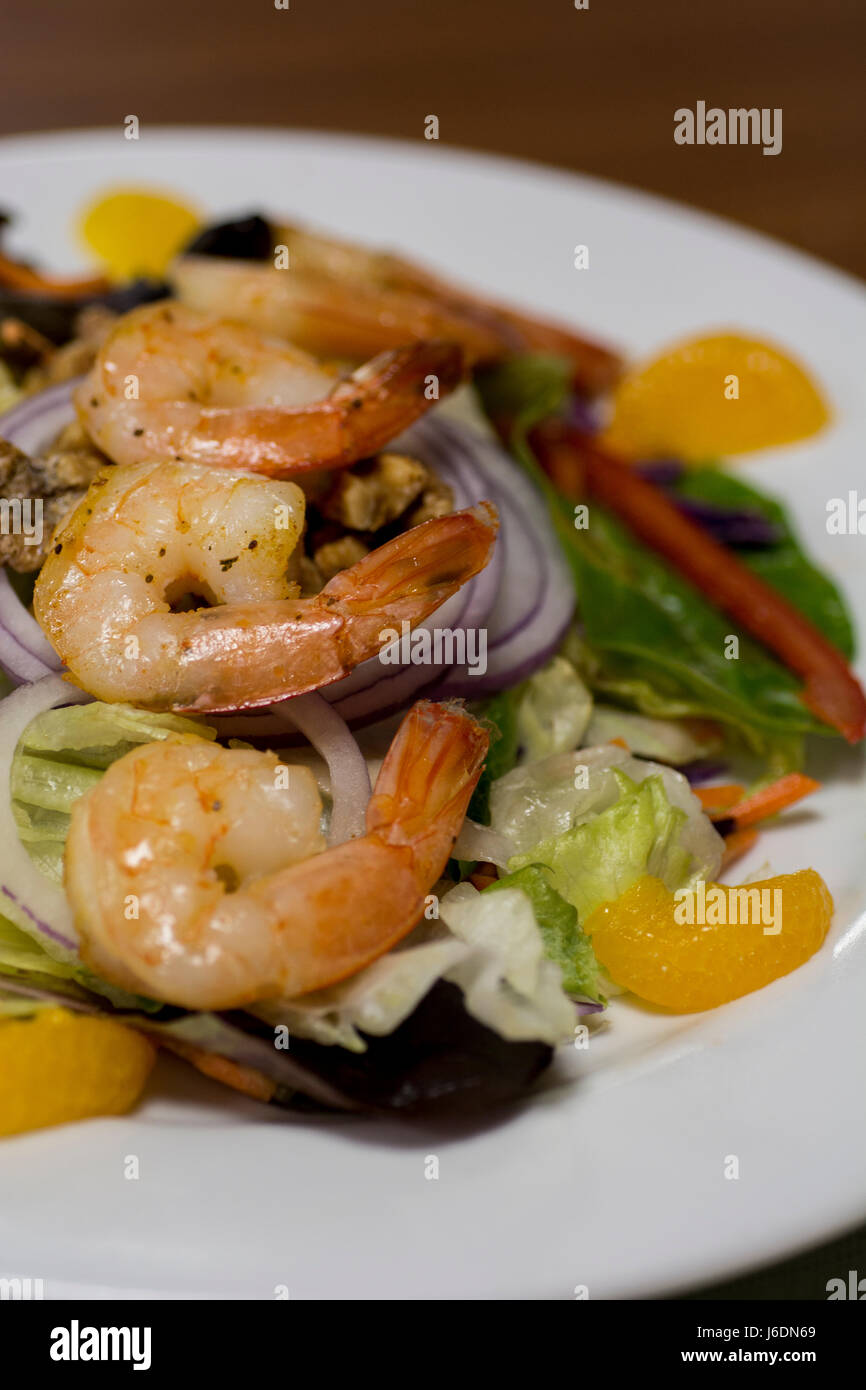 Lunch, Mandarin orange shrimp salad with candied walnuts. Stock Photo