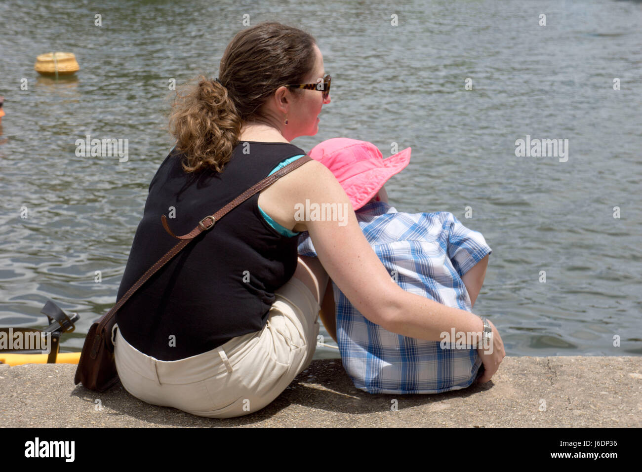 Mother and young son enjoying time together at the lake. Stock Photo