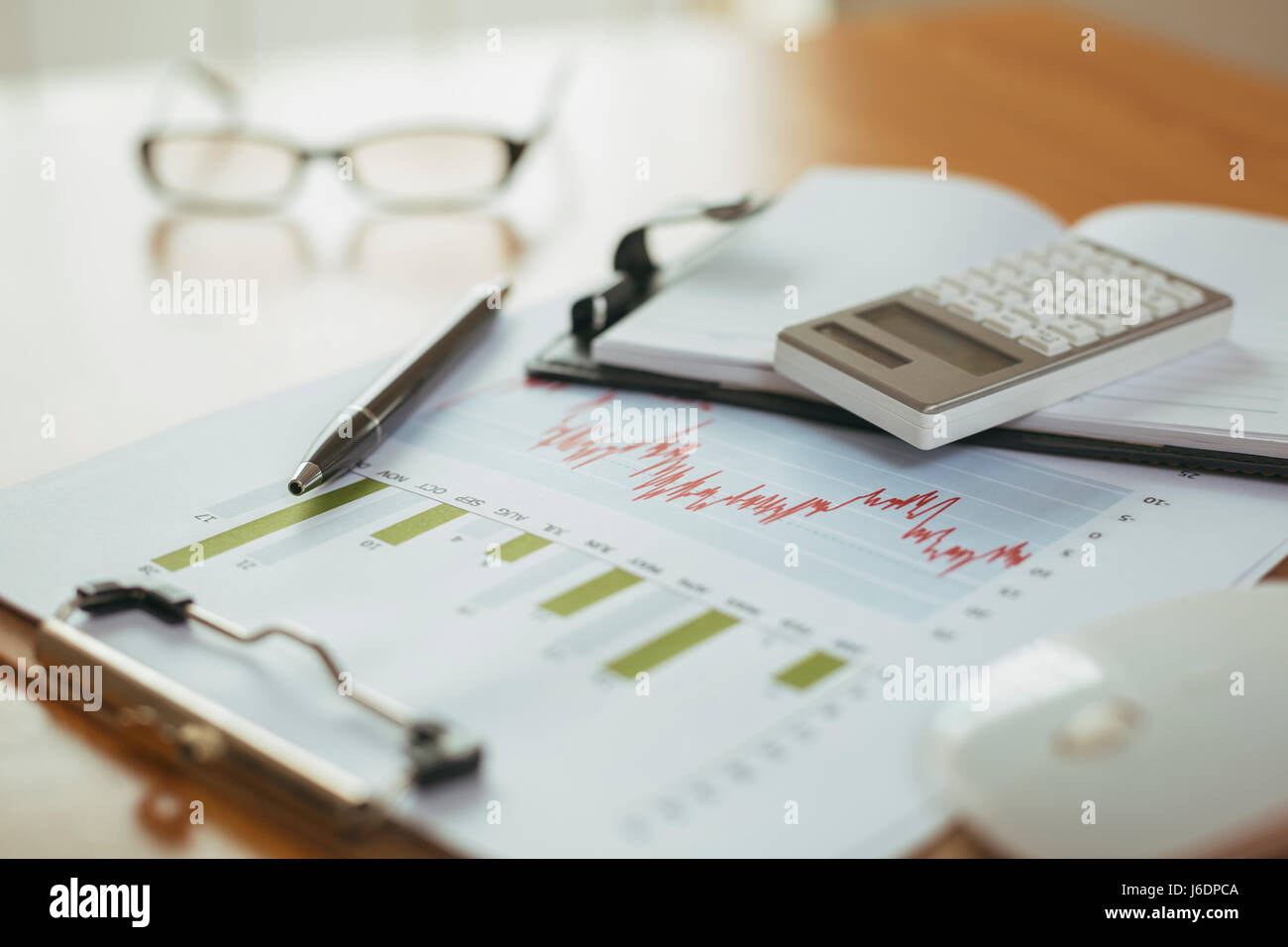 preparation of office desk with office supplies, analysis chart and glasses Stock Photo
