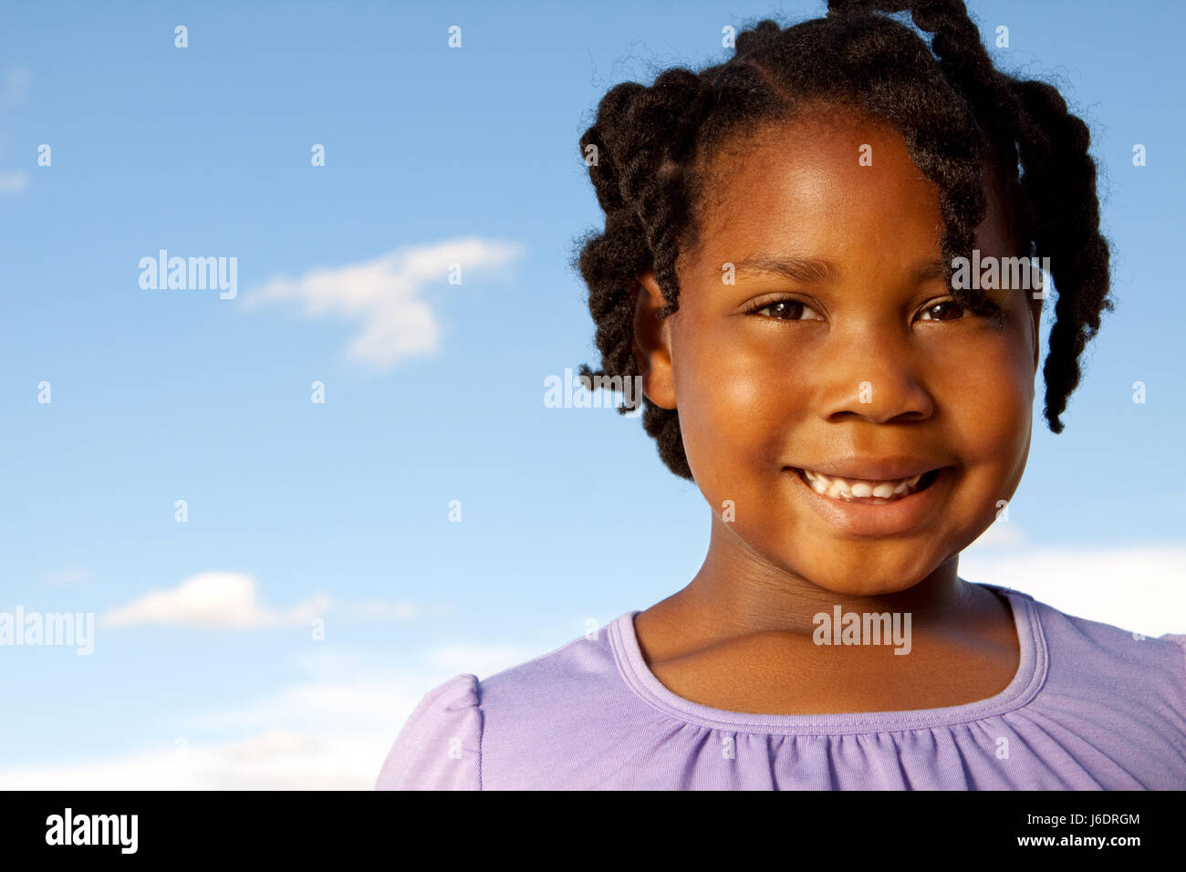 Happy African American girl smiling outside Stock Photo - Alamy