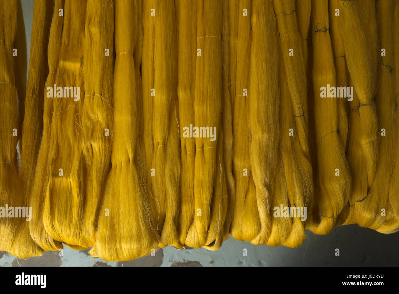 Display of raw silk yarns in a silk factory. Rajshahi, Bangladesh Stock Photo