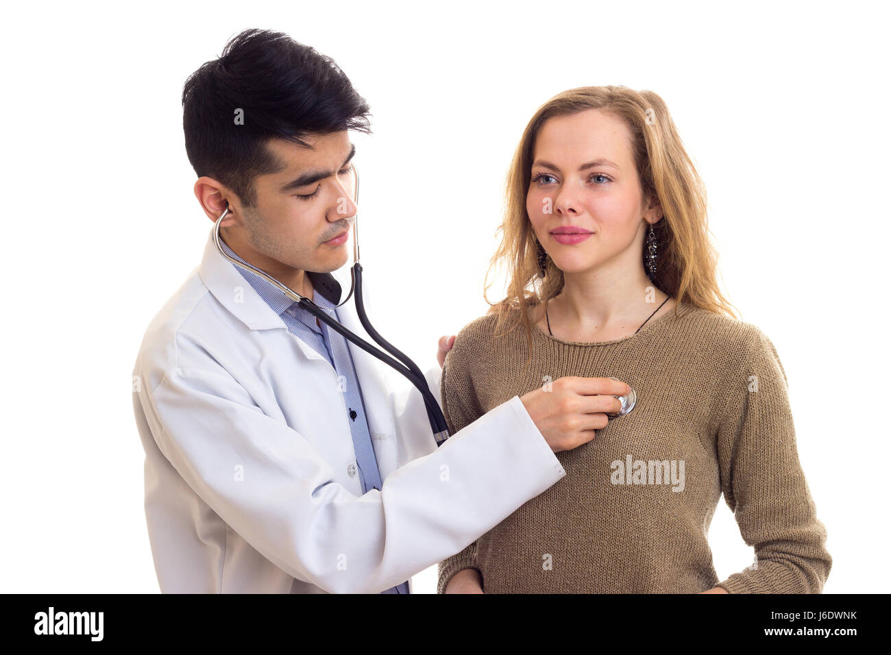 Doctor Listening Heartbeat Of The Woman Stock Photo Alamy