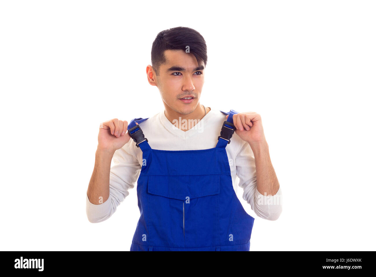 Young man in blue overall Stock Photo