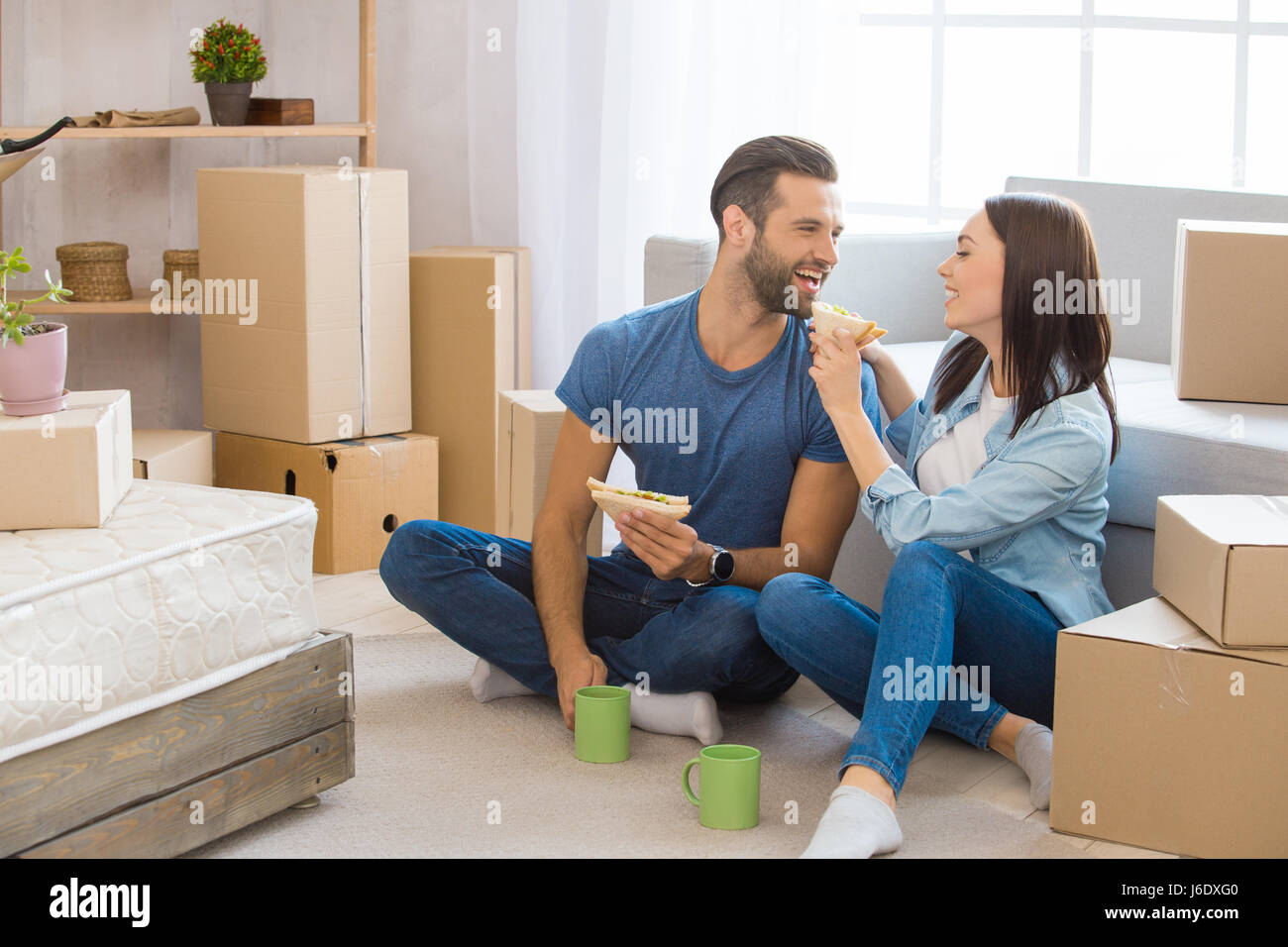 Young couple moving to a new apartment together relocation Stock Photo ...