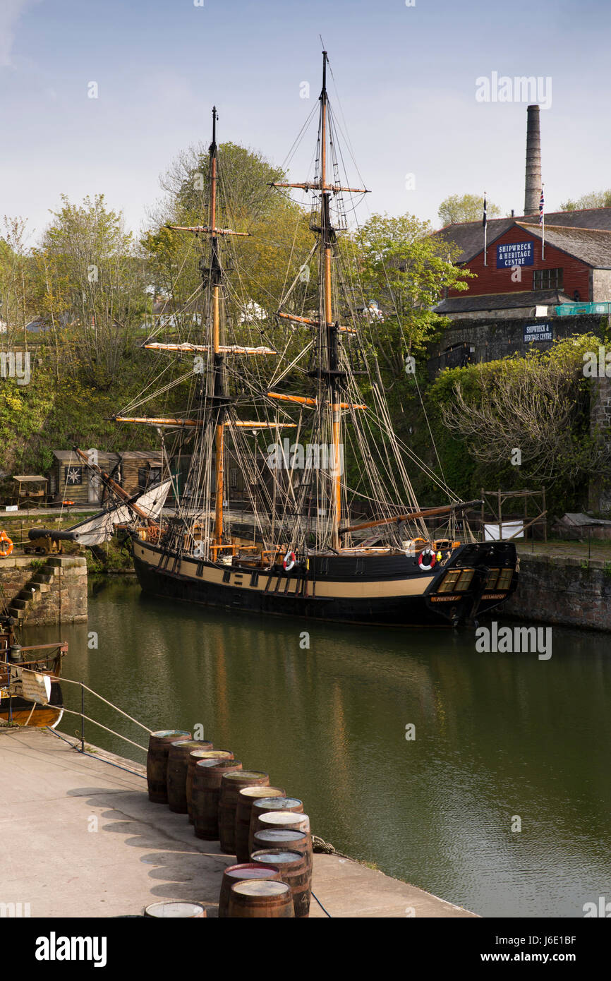 UK, Cornwall, St Austell, Charlestown, tall sailing ship Phoenix, 1929 built two masted brig moored in harbour moored below Shipwreck Museum Stock Photo