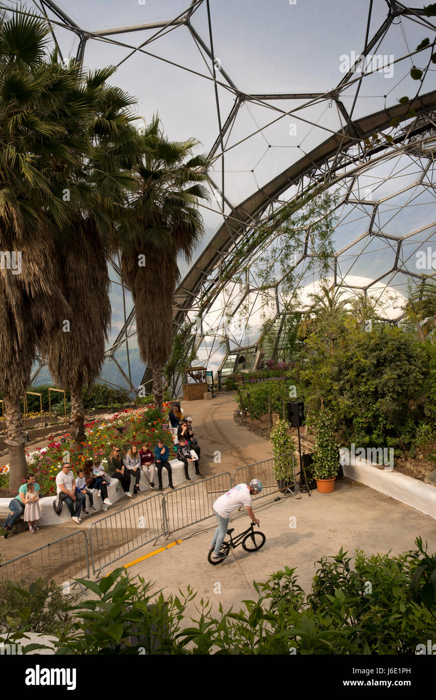 UK, Cornwall, St Austell, Bodelva, Eden Project, Mediterranean Biome, BMX stunt rider demonstrating tricks Stock Photo