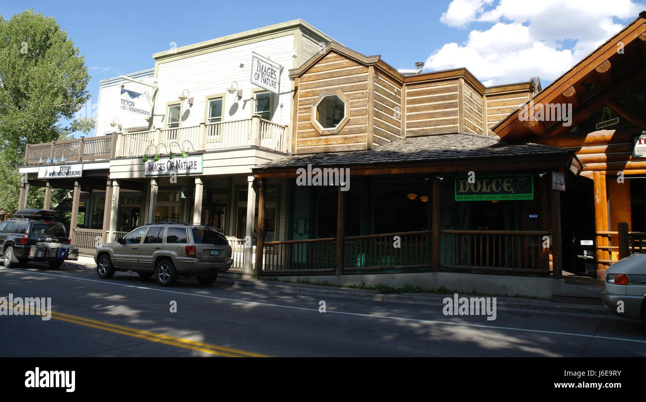 Sunny view south across North Cache Street to wooden buildings Dolce