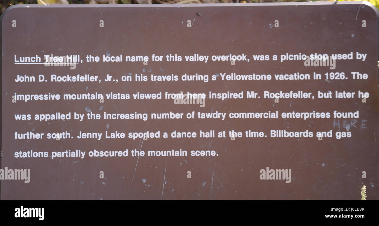 Lunch Tree Hill information sign about John D. Rockefeller JR being appalled by later commercial enterprises in the Grand Teton National Park, Wyoming Stock Photo