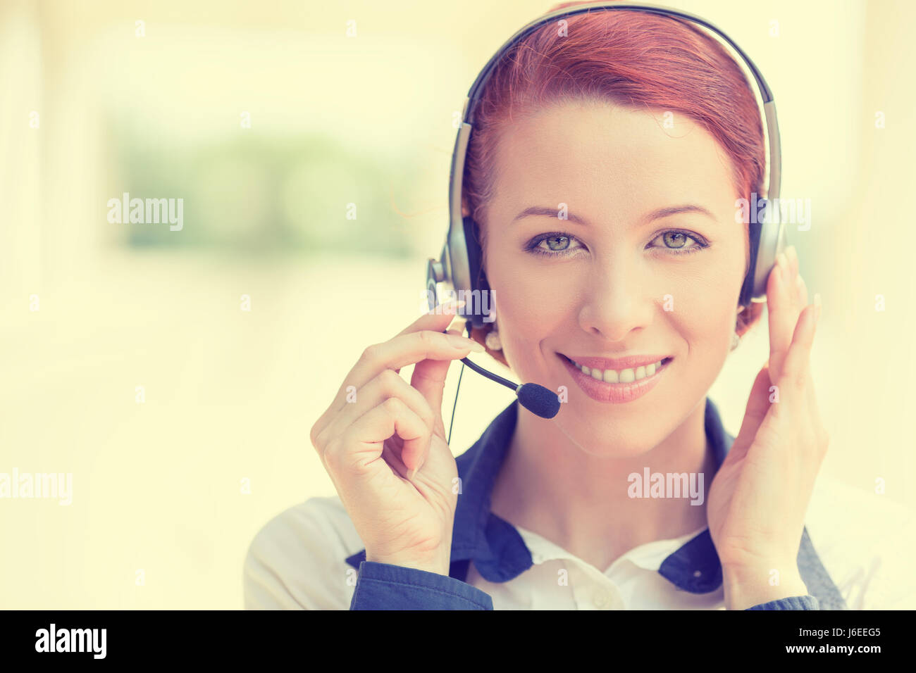 Customer service representative wearing a headset isolated on office