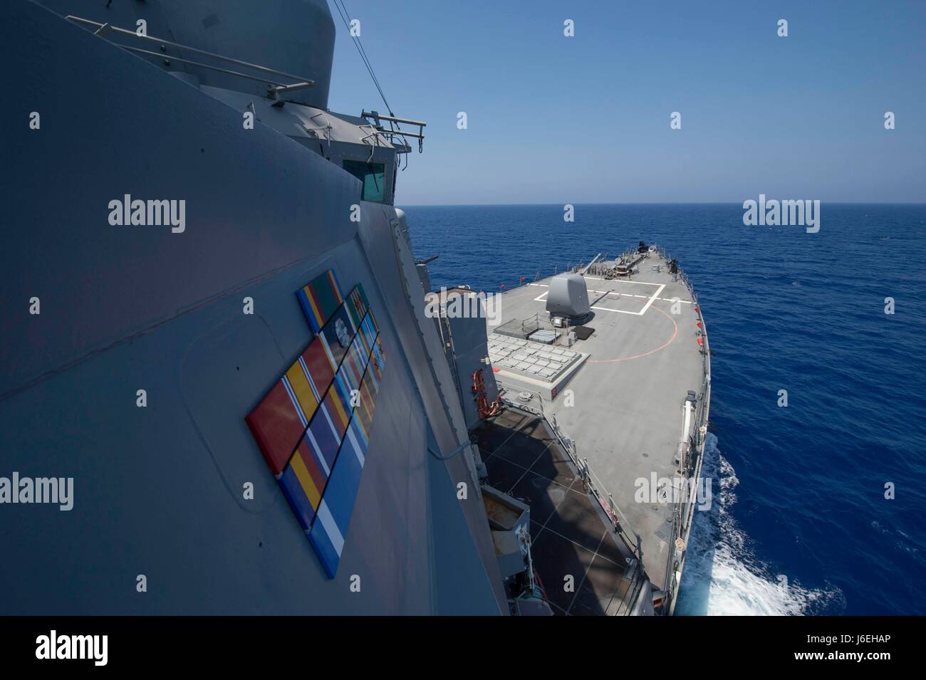 An arleigh burke class guided missile destroyer forward deployed to ...