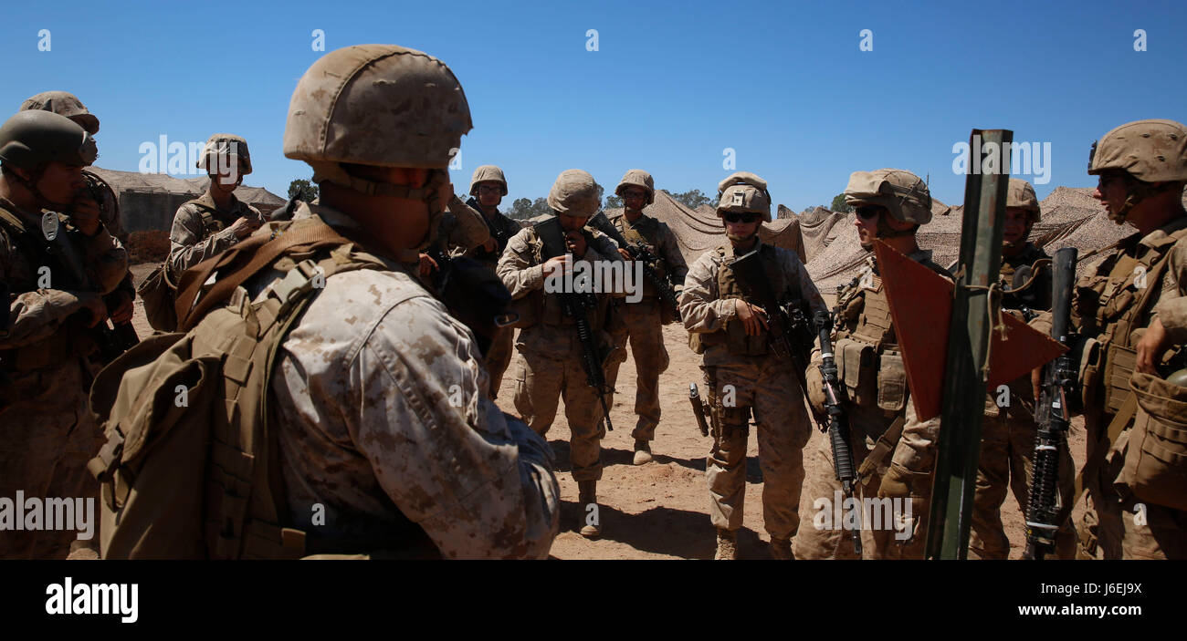 Hospital Corpsman 1st Class (HM1) Samantha Clark and Hospital Corpsman 2nd Class Joseph Muniz with I Marine Expeditionary Force Headquarters Group (I MHG) treat a simulated casualty at an expeditionary aid station during a mass-casualty drill as part of the I Marine Expeditionary Force Large Scale Exercise 2016 at Marine Corps Air Station Miramar, Aug.16, 2016. The corpsmen trained with the Marines to be prepared for future real life situations in which they may have to deal with multiple casualties at the time. Large Scale Exercise 2016 (LSE-16) simulates the planning, deployment and combat o Stock Photo