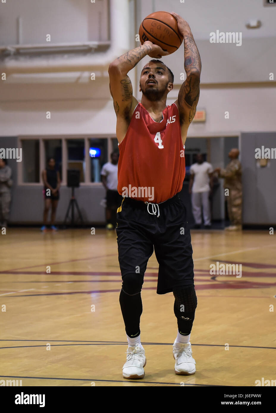 Lonnie Perrin, a member of the 1st Special Operations Medical Group basketball team, shoots a free throw during the intramural basketball championship at the Aderholt Fitness Center on Hurlburt Field, Fla., April 6, 2017. For eight weeks, 12 teams competing through a single-elimination tournament to qualify for the championship game. (U.S. Air Force photo by Airman 1st Class Joseph Pick) Stock Photo