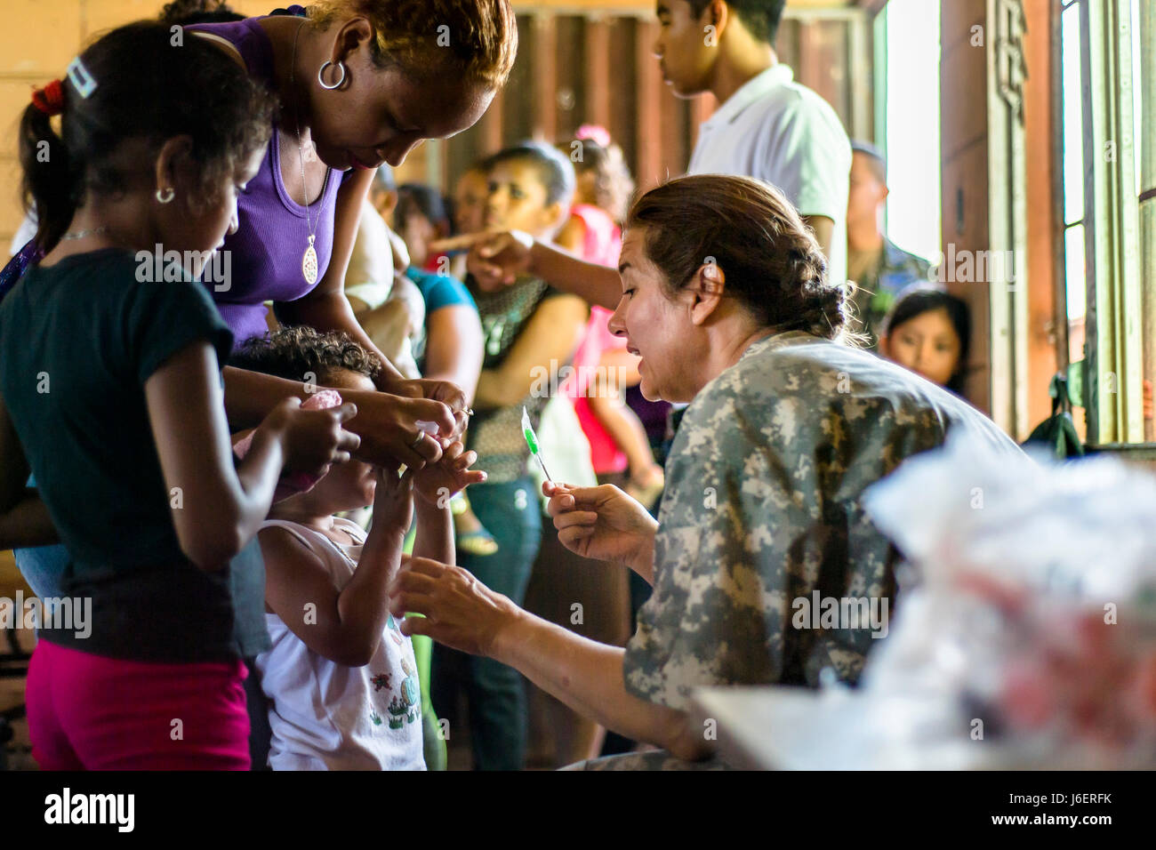 U.S. Army LTC. Rhonda Dyer provides deworming and preventative medication to Hondurans at a Medical Readiness Training Exercise site at Cooperativa village, Colon, Honduras , Apr. 21, 2017. Joint Task Force – Bravo Medical Element, provided care to more than 850 patients during a Medical Readiness Training Exercise in Cooperativa village, Colon, Honduras, Apr. 20-21, 2017. MEDEL also supported a Military Partnership Engagement and assisted more than 650 patients with the Hondurian Navy in Santa Rosa de Aguan, Colon, Honduras, Apr. 22, 2017. (U.S. Air National Guard photo by Master Sgt. Scott T Stock Photo