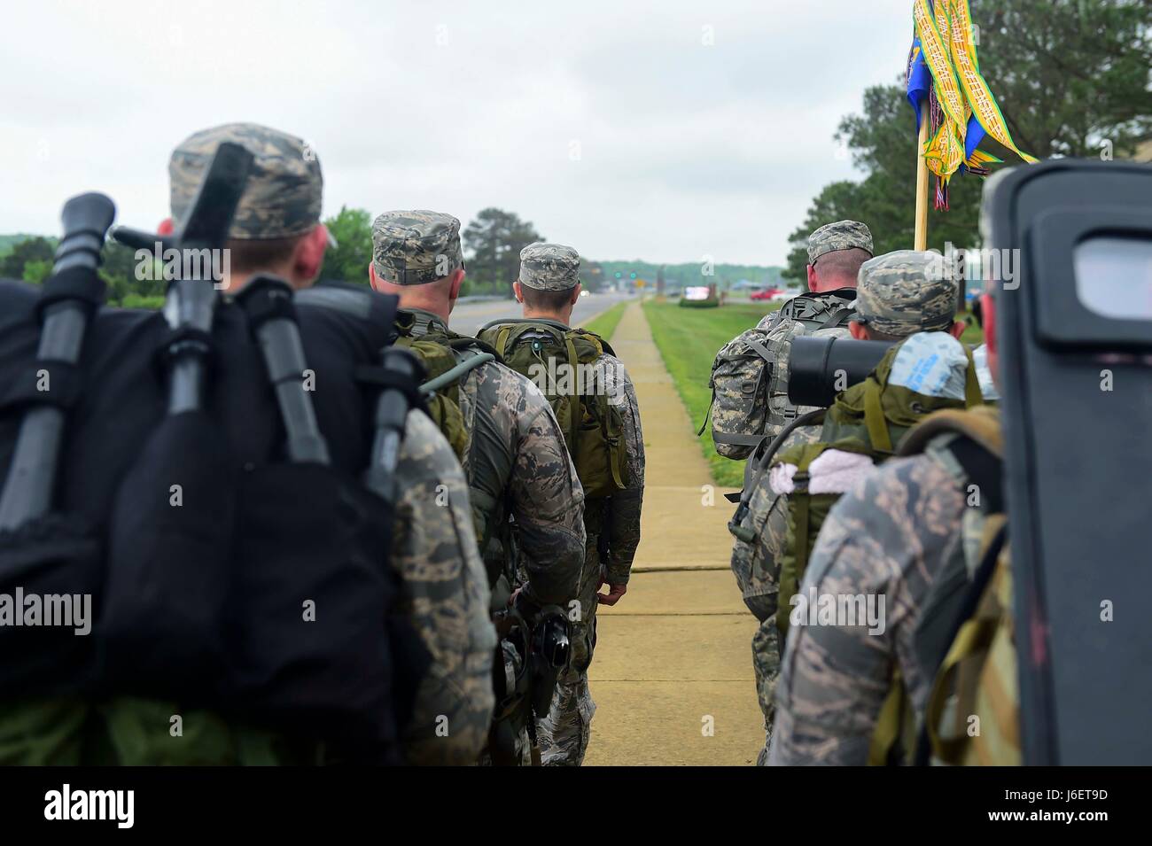 Members of the 633rd Security Forces Squadron Emergency Services Team performed a ruck march from Shellbank Fitness Center to Combat Arms Training at Joint Base Langley-Eustis, Va., April 28, 2017. The EST members developed and tested a qualification course, based on the teams abilities to effectively handle hostage and barricaded suspect scenarios, which will be used to assess future candidates looking to join the team. (U.S. Air Force photo/Senior Airman Derek Seifert) Stock Photo