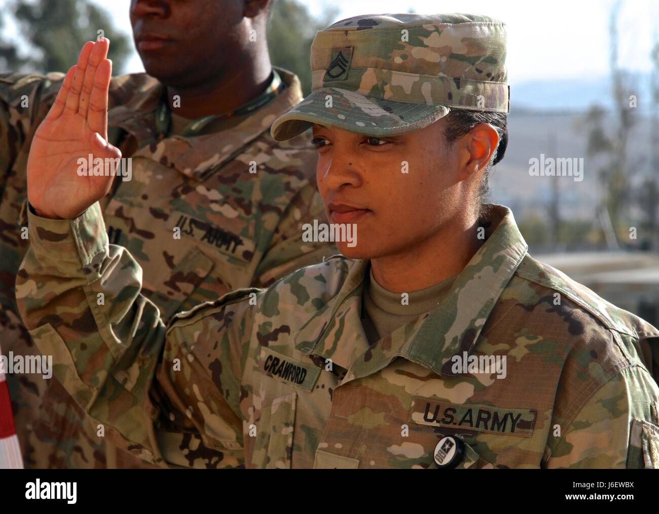 Staff Sgt. Christal Crawford, USARCENT broadcast specialist, takes the oath of enlistment, May 5, 2017, during exercise Eager Lion in Jordan. Stock Photo
