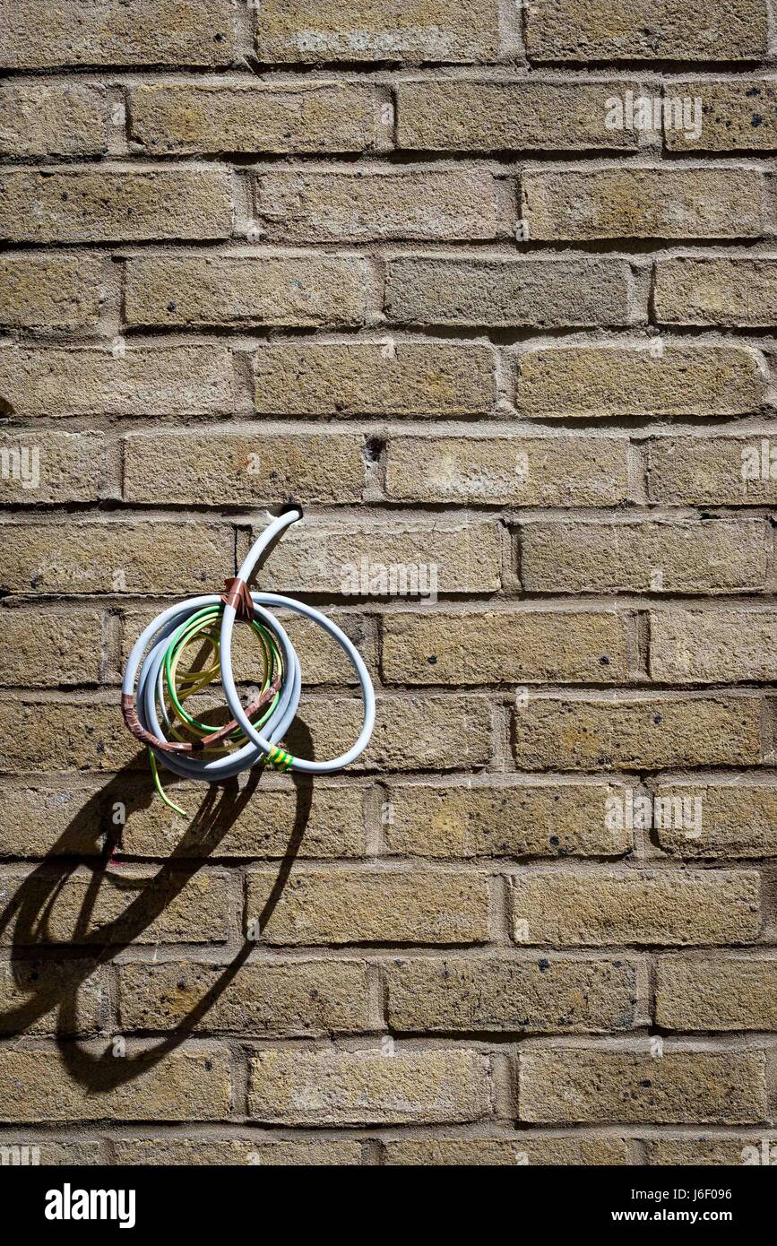 Wires poking out from wall Stock Photo Alamy