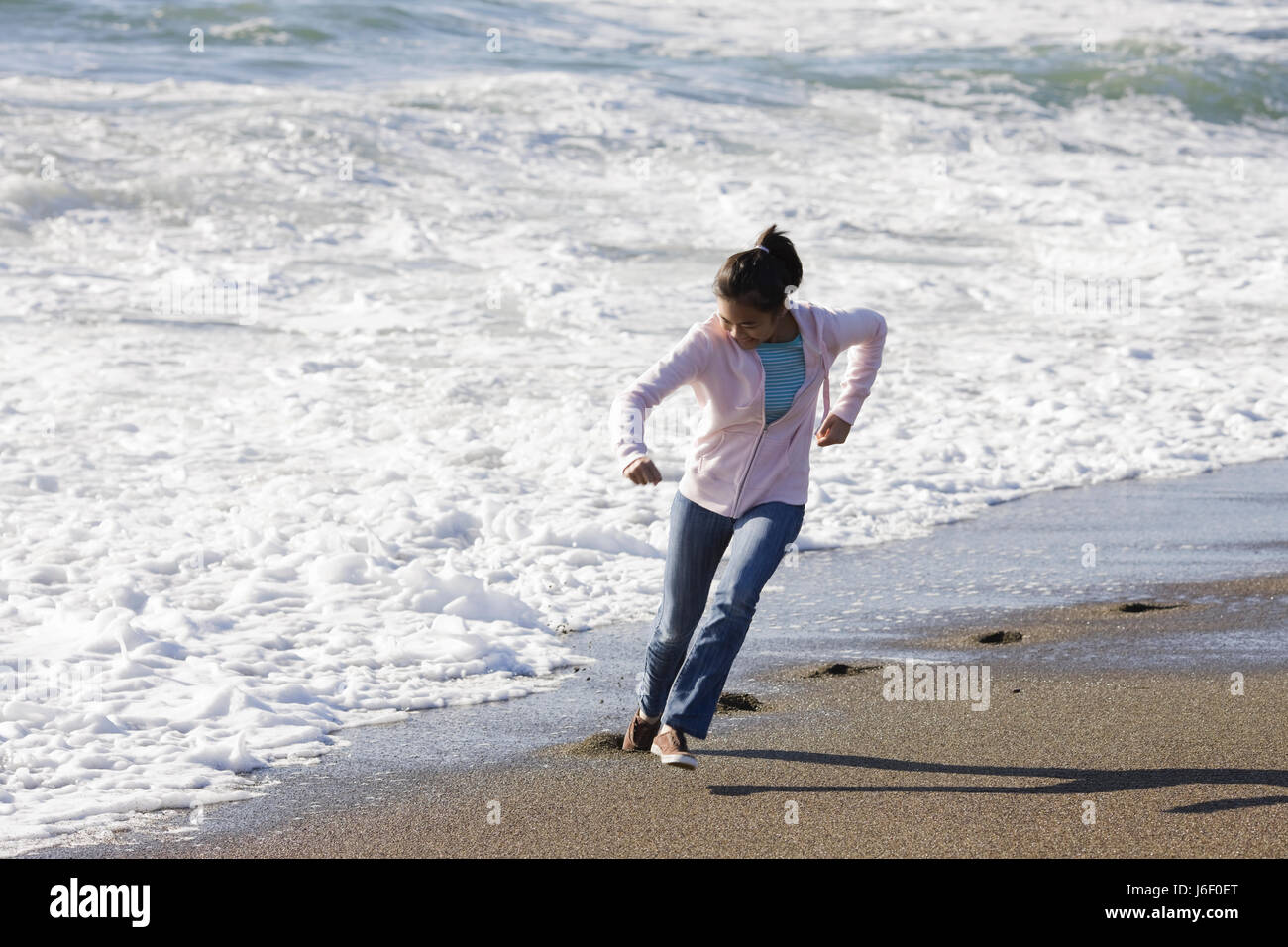 beach seaside the beach seashore waves active girl girls woman spare time  free Stock Photo - Alamy