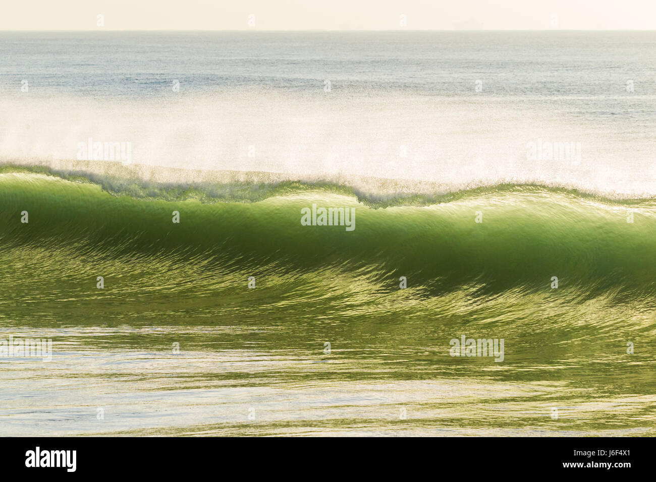 Wave curling crashing water closeup ocean beach Stock Photo