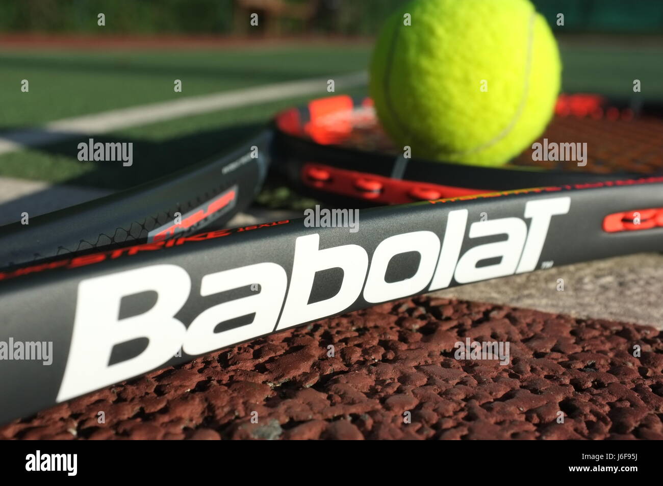 Tennis ball on a Babolat racquet on a hard court in London, UK Stock Photo