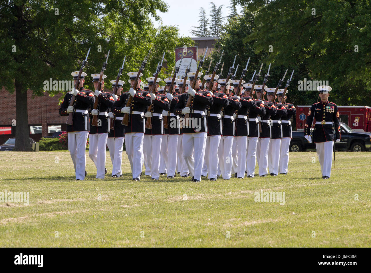 The U.S. Marine Corps Silent Drill Platoon march during the Centennial Celebration Ceremony at Lejeune Field, MCB Quantico, Va., May 10, 2017. The event commemorates the founding of MCB Quantico in 1917, and consisted of performances by the U.S. Marine Corps Silent Drill Platoon and the U.S. Marine Drum & Bugle Corps. (U.S. Marine Corps photo by Lance Cpl. Cristian L. Ricardo) Stock Photo