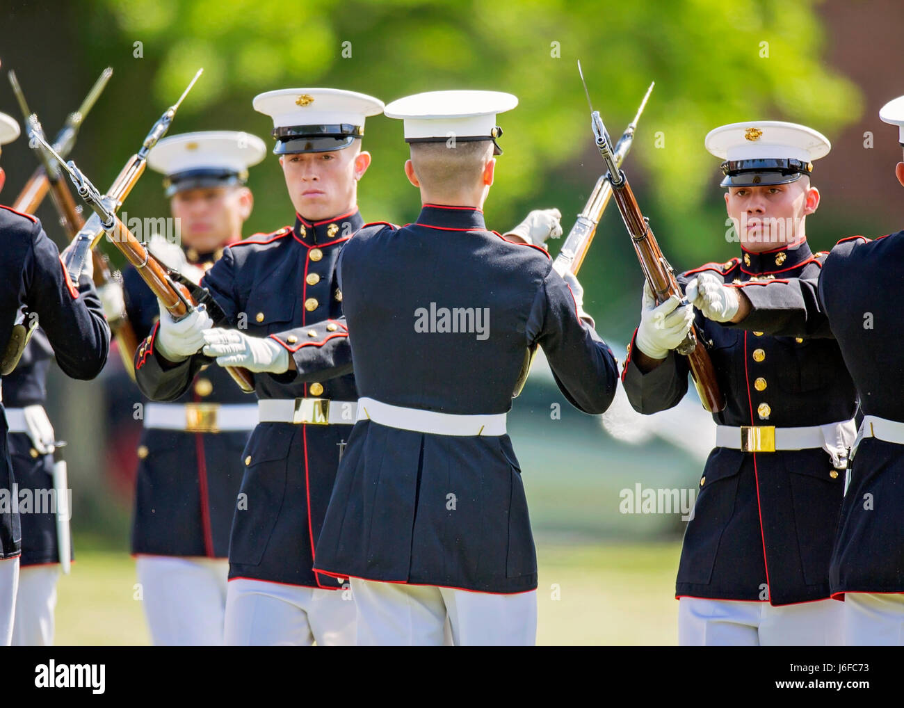 The U.S. Marine Corps Silent Drill Platoon performs during the Centennial Celebration Ceremony at Lejeune Field, Marine Corps Base (MCB) Quantico, Va., May 10, 2017. The event commemorates the founding of MCB Quantico in 1917, and consisted of performances by the U.S. Marine Corps Silent Drill Platoon and the U.S. Marine Drum & Bugle Corps. (U.S. Marine Corps photo by James H. Frank) Stock Photo