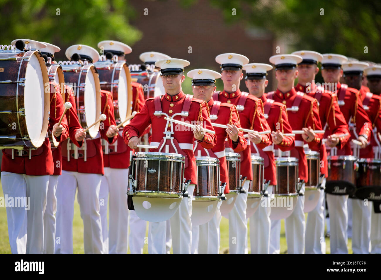 The U.S. Marine Drum & Bugle Corps march during the Centennial Celebration Ceremony at Lejeune Field, Marine Corps Base (MCB) Quantico, Va., May 10, 2017. The event commemorates the founding of MCB Quantico in 1917, and consisted of performances by the U.S. Marine Corps Silent Drill Platoon and the U.S. Marine Drum & Bugle Corps. (U.S. Marine Corps photo by James H. Frank) Stock Photo