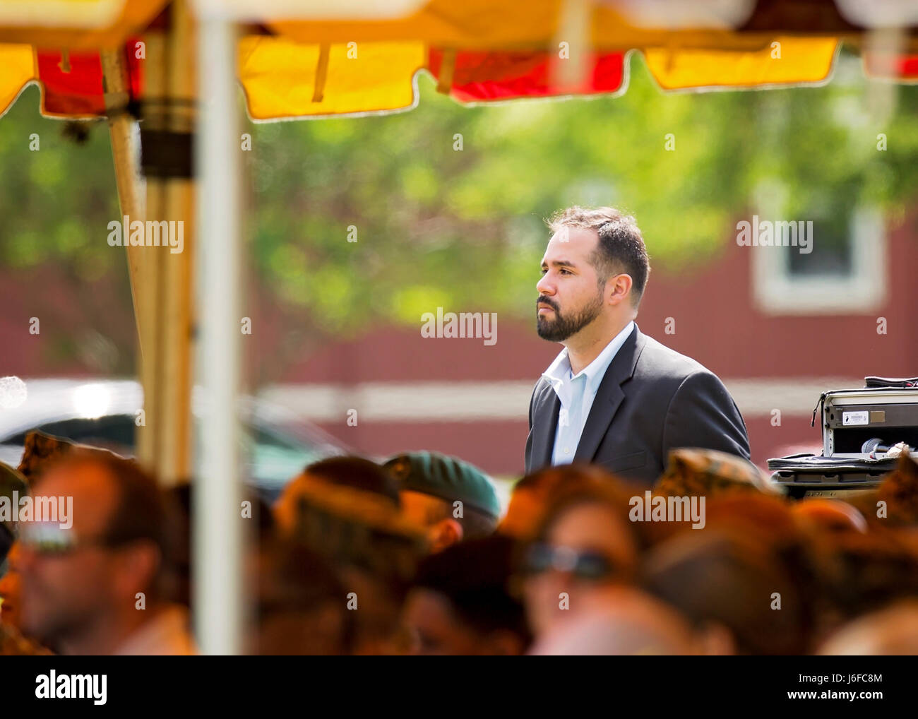 Attendee Charley Galarza watches the Centennial Celebration Ceremony at Lejeune Field, Marine Corps Base (MCB) Quantico, Va., May 10, 2017. The event commemorates the founding of MCB Quantico in 1917, and consisted of performances by the U.S. Marine Corps Silent Drill Platoon and the U.S. Marine Drum & Bugle Corps. (U.S. Marine Corps photo by James H. Frank) Stock Photo