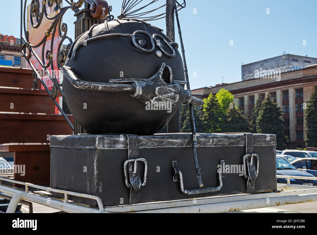 Funny outdoor metal sculpture in the form of a Bun and suitcase Stock Photo