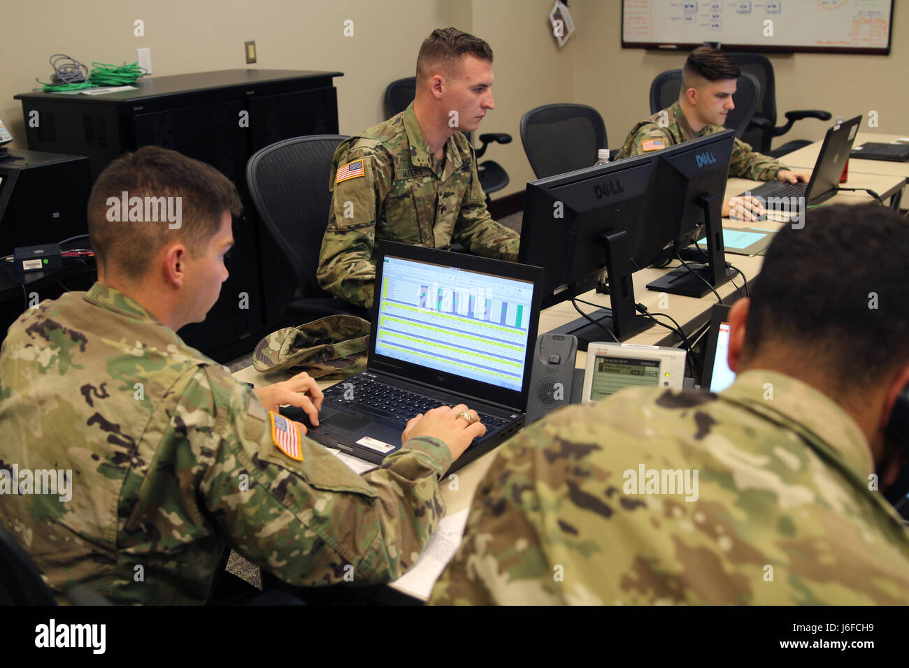 Spc. David Walters, Pfc. Quentin Oswalt, 2nd Lt. Michael Snyder, and Cpt. Anthony Rose with the South Carolina Army National Guard react to an air mission request in suport of Eager Lion 2017 at Joint Force Command, Suffolk, Va. Eager Lion is an annual U.S. Central Command exercise in Jordan designed to strengthen military-to-military relationships between the U.S., Jordan and other international partners. This year's iteration is comprised of about 7,200 military personnel from more than 20 nations that will respond to scenarios involving border security, command and control, cyber defense an Stock Photo