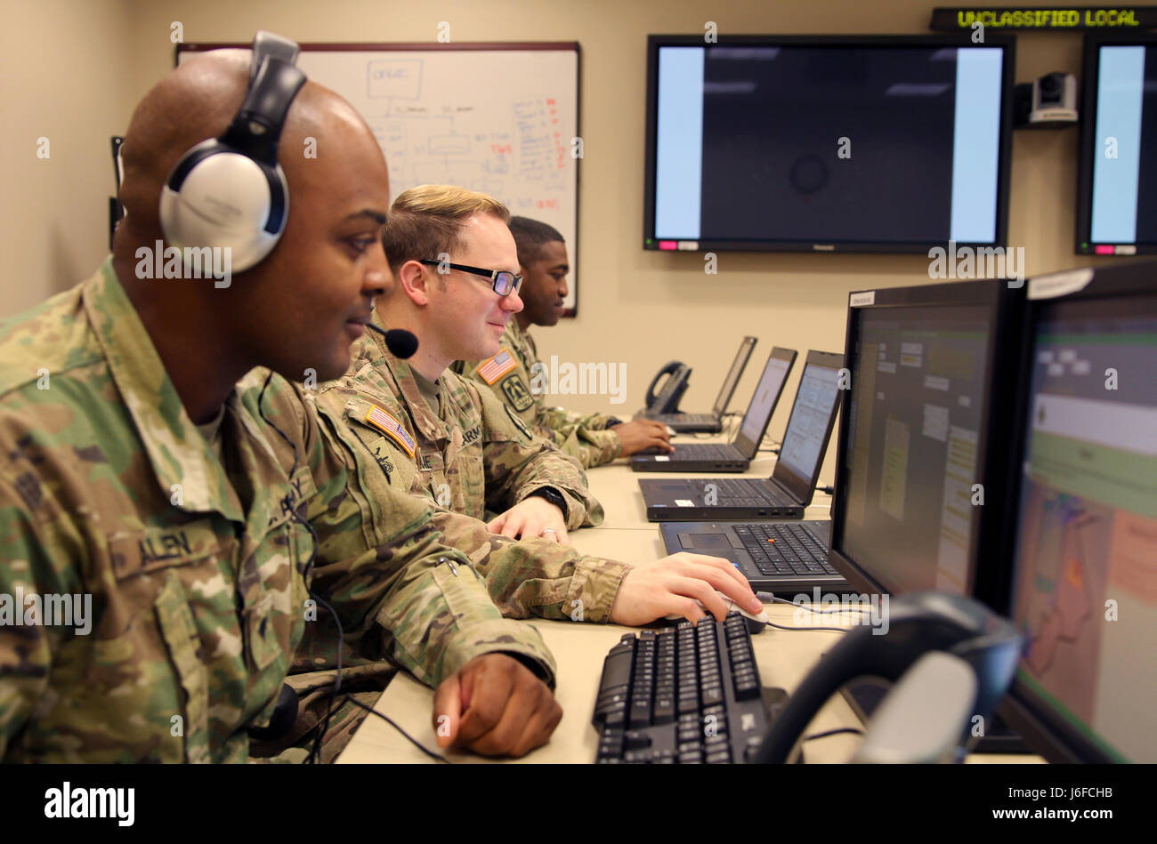 Spc. Tracy William, Sgt. Colton Cragne, and Spc. Thomas Allen with the South Carolina Army National Guard coordinates with the Notional Air Defense Artillery Brigade located in Jordan, at Joint Force Command, Suffolk, Va. Eager Lion is an annual U.S. Central Command exercise in Jordan designed to strengthen military-to-military relationships between the U.S., Jordan and other international partners. This year's iteration is comprised of about 7,200 military personnel from more than 20 nations that will respond to scenarios involving border security, command and control, cyber defense and battl Stock Photo