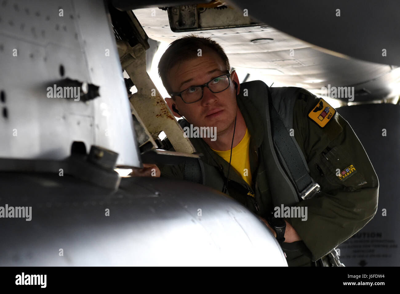 Capt. Michael D. Mosteller, 336th Fighter Squadron weapon systems officer, inspects an F-15E Strike Eagle, May 12, 2017, at Seymour Johnson Air Force Base, North Carolina. Mosteller inspected the Strike Eagle prior to taking off to participate in the monthly exercise Razor Talon. (U.S. Air Force photo by Airman 1st Class Victoria Boyton) Stock Photo