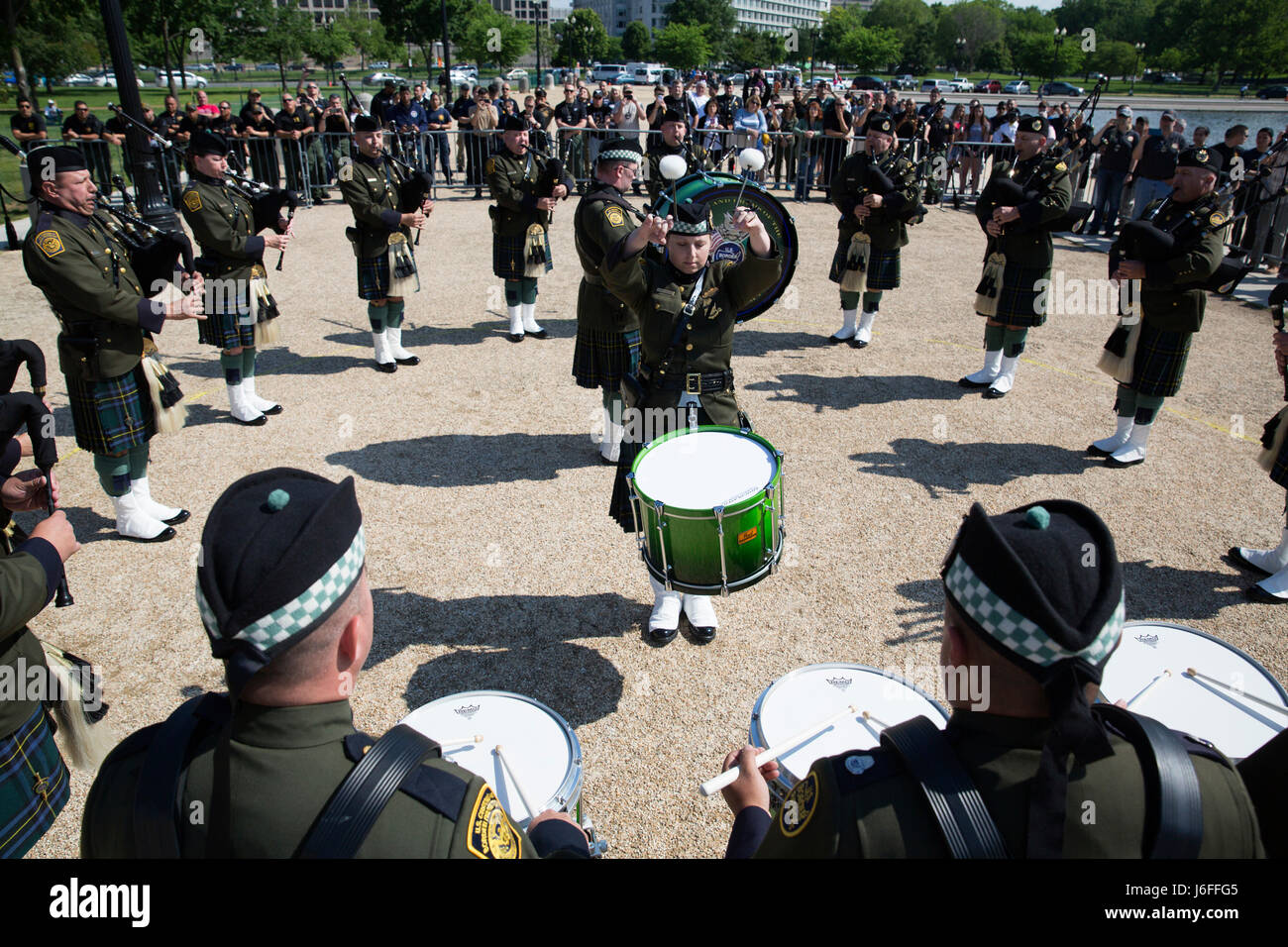 Members of the U.S. Border Patrol Pipes and Drums perform during the
