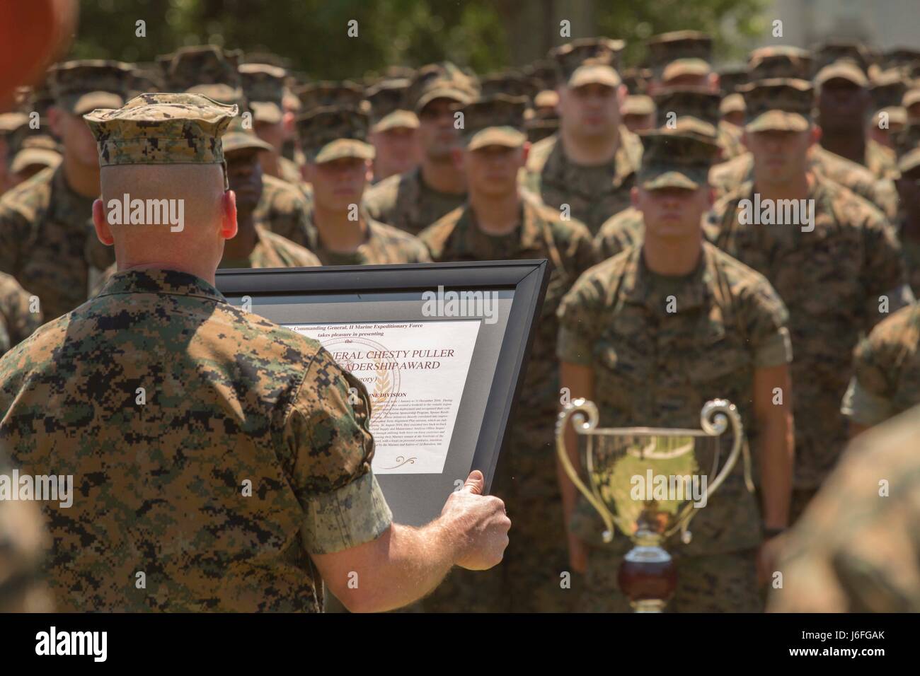 Major Gen. John K. Love, the commanding general of 2nd Marine Division, speaks to Marines during a Chesty Puller award ceremony at Camp Lejeune, N.C., May 15, 2017. The Marines earned the award due to their impressive conduct in combat, garrison and in the field of innovation throughout the calendar year of 2016. The Marines are with 2nd Battalion, 6th Marine Regiment, 2nd Marine Division. (U.S. Marine Corps photo by Pfc. Abrey D. Liggins) Stock Photo