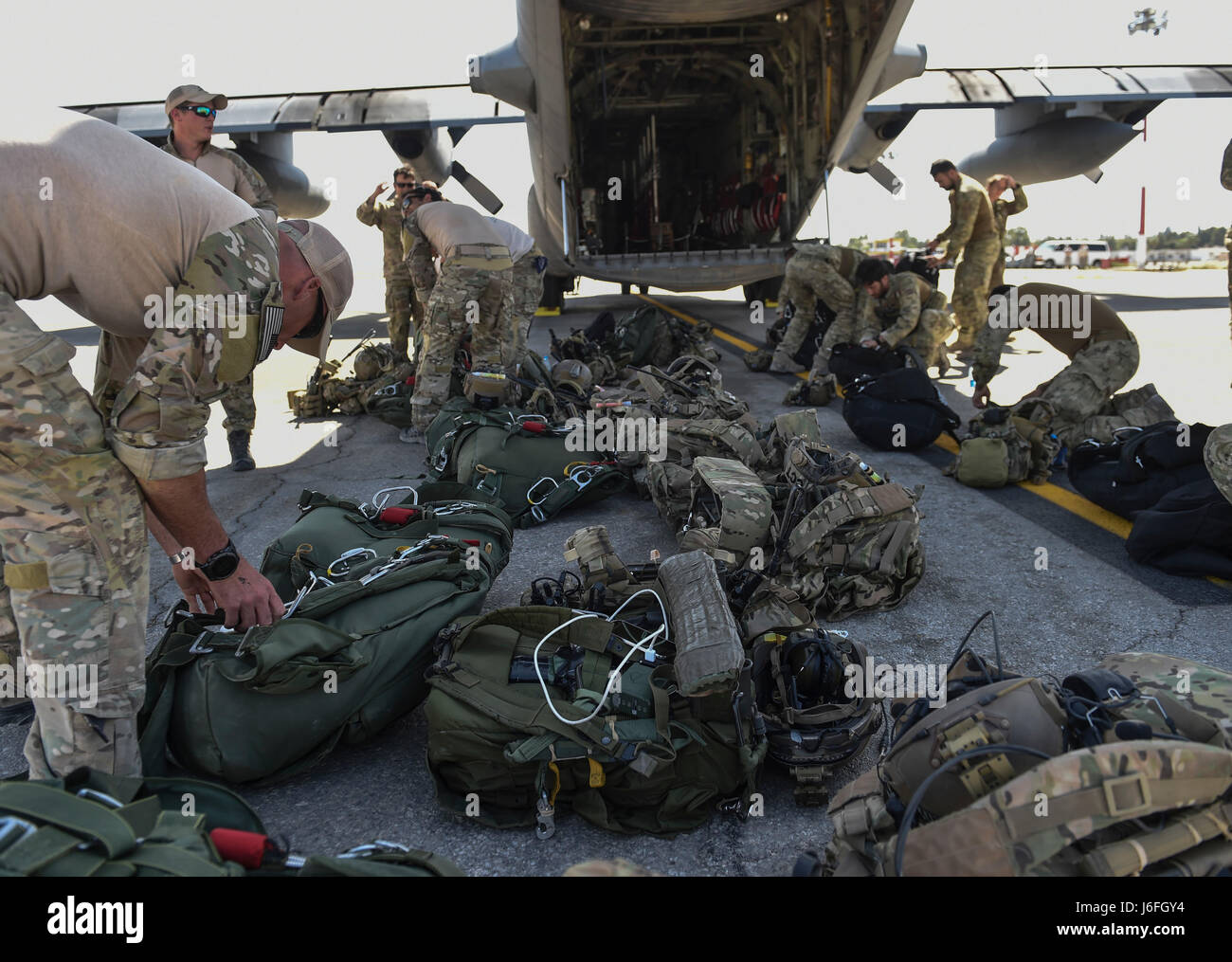U.S. Air Force and Italian special tactics personnel conduct pre-jump ...