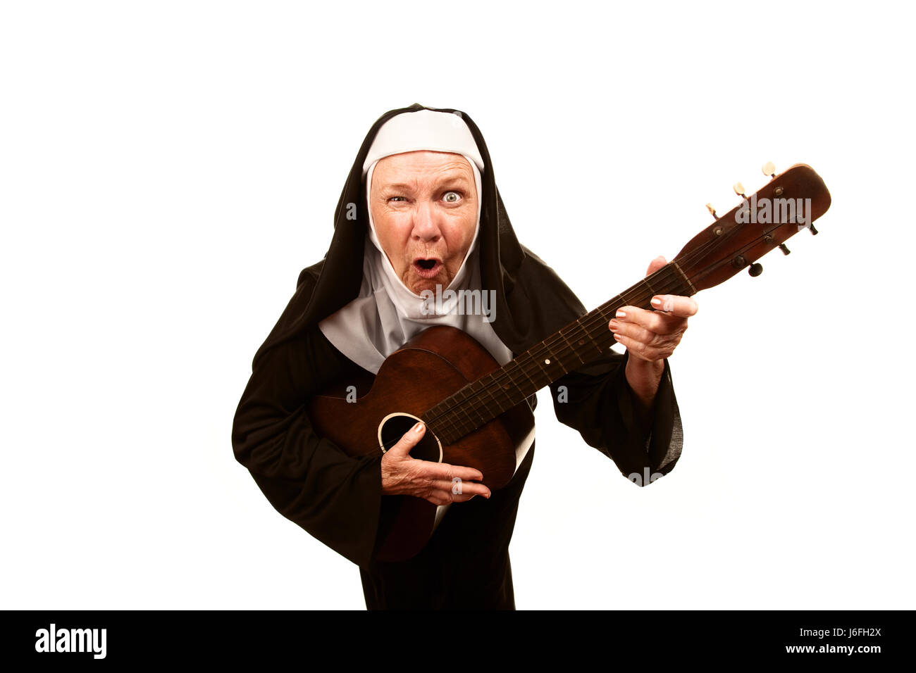 woman-religion-religious-guitar-catholic-nun-elderly-senior-senior-J6FH2X.jpg