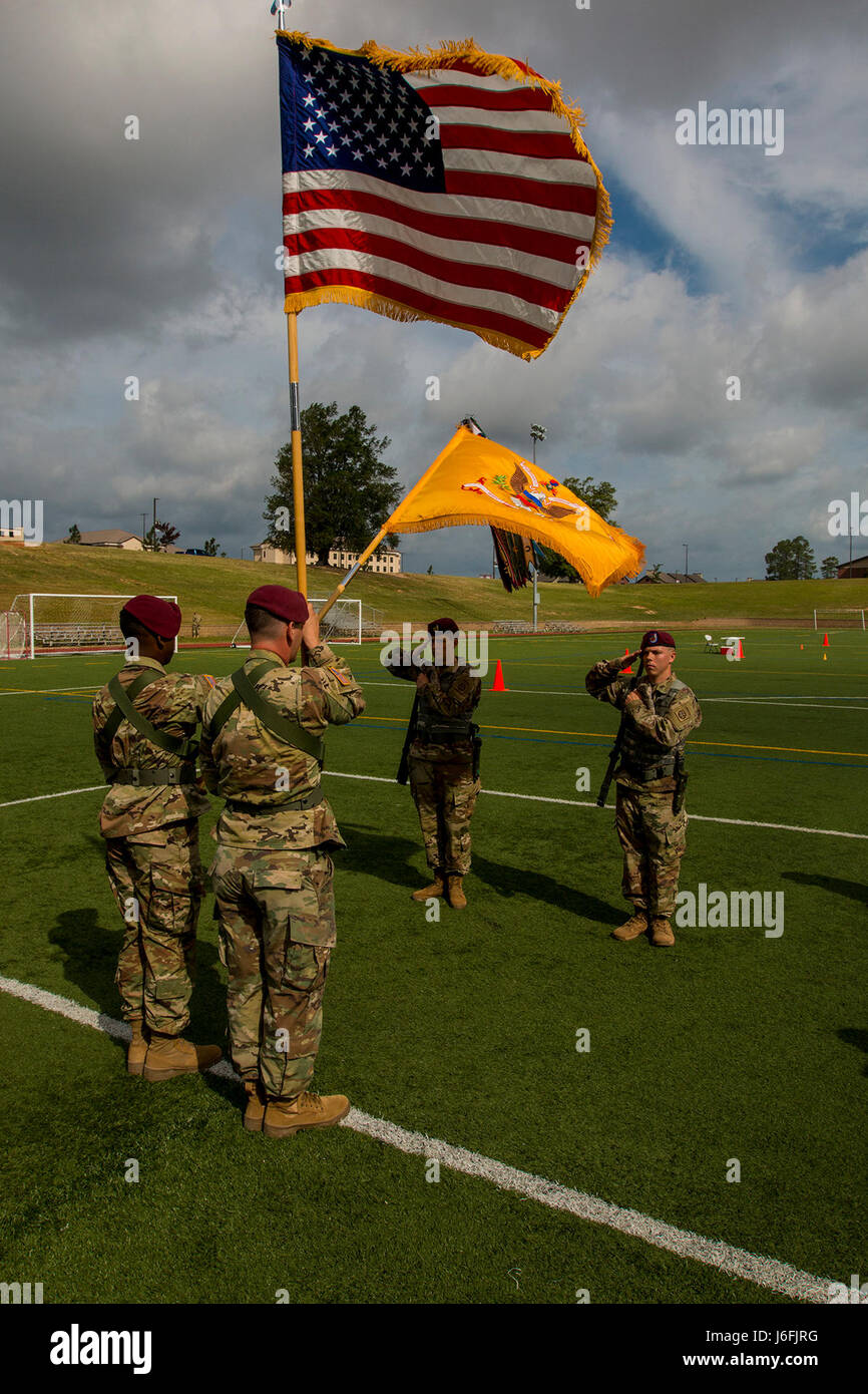 Paratroopers of the 5th Battalion, 73rd Cavalry Regiment, 3rd Brigade Combat Team, 82nd Airborne Division, salute their Regimental Colors during day one of the Color Guard and Guidon Competition at Towle Stadium on Fort Bragg, N.C., May 18, 2017. The Division's legacy as 'America's Guard of Honor' is traced back to the American color guard in Berlin after World War II. In honor of the proud history of the 82nd, we continue to carry on the tradition of Paratroopers past and present. (U.S. Army photo by Spc. L'Erin Wynn) Stock Photo